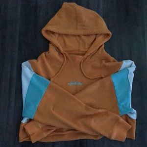 A cropped yellow hoodie from Hollister.